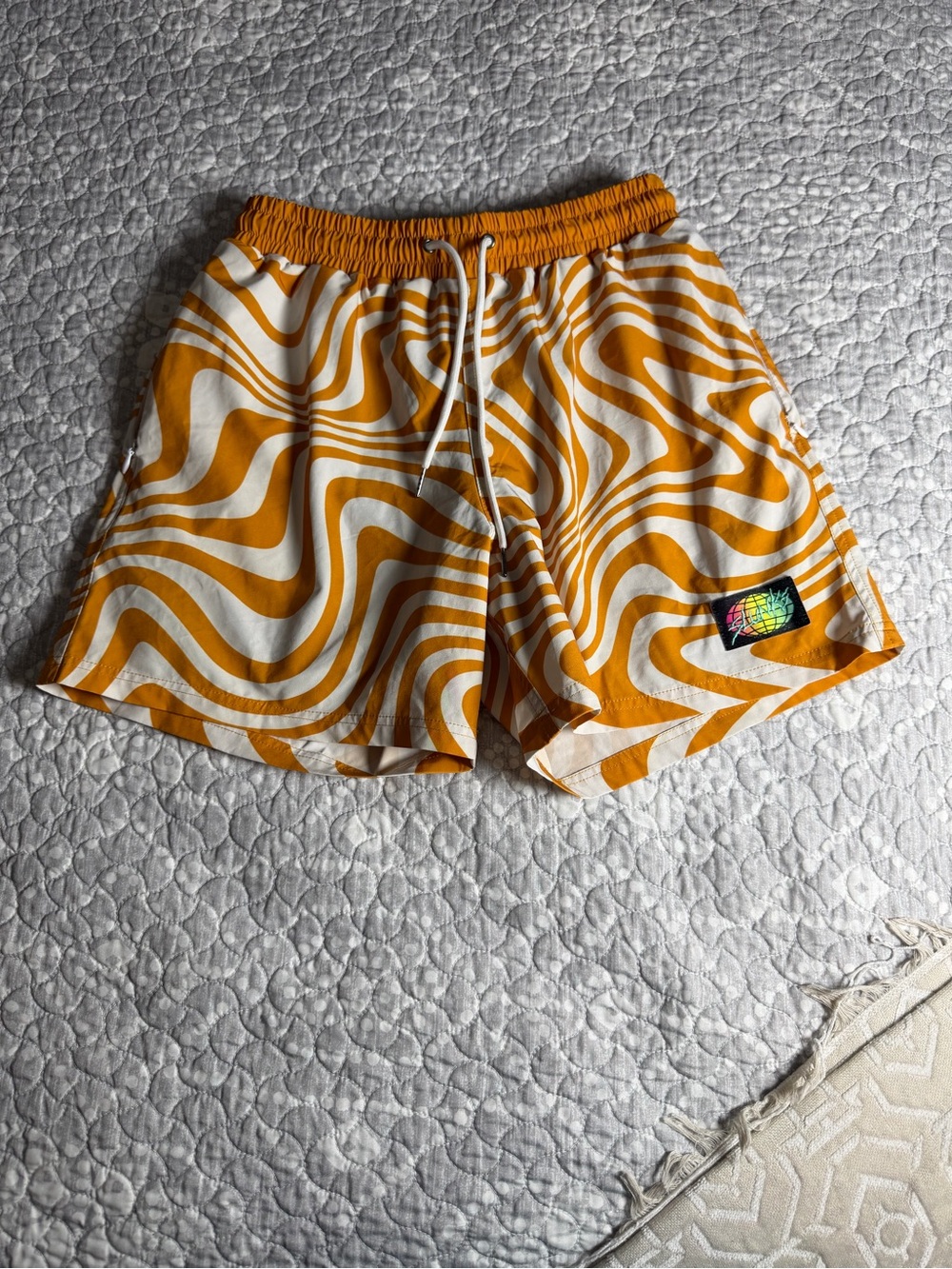 Slunks Orange and White Swirl Athletic Shorts. Mens size small.